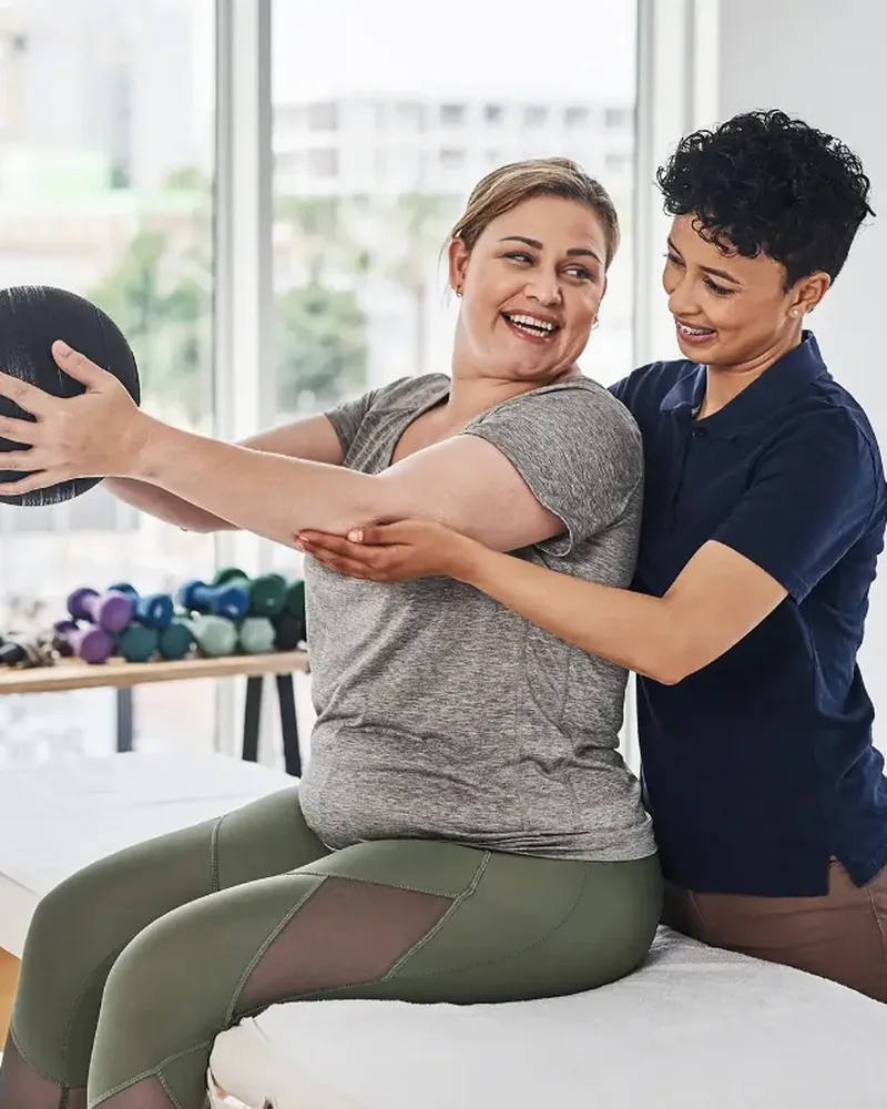 Doctor of Physical Therapy working one on one with a patient
